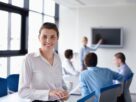 A person learning a foreign language in a work environment, aiming for career growth.