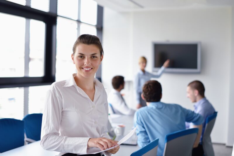 A person learning a foreign language in a work environment, aiming for career growth.